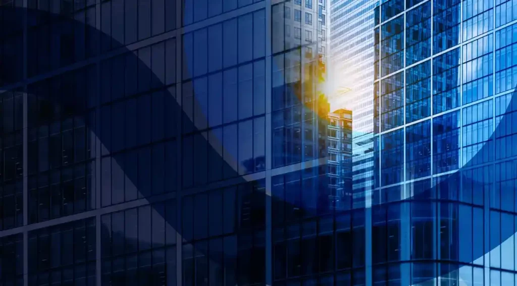 Glass building facade representing investment bank risk management challenges