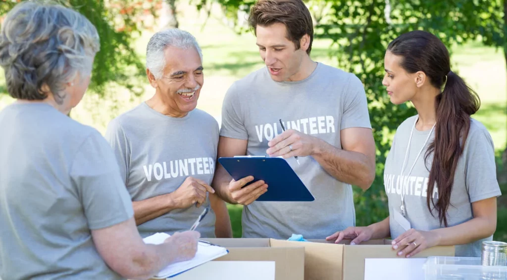 charity volunteers checking discussing the organisation's compliance to law and regulations